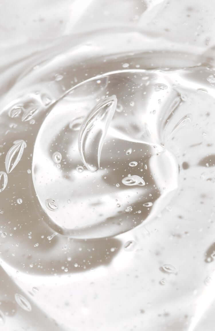 Close-up of clear gel with bubbles, showcasing hydration and moisture for skin care.