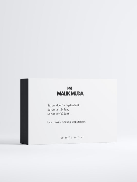 Coffret LES 3 SÉRUMS CAPITAUX de Malik Muda, incluant sérums hydratant, anti-âge et exfoliant.